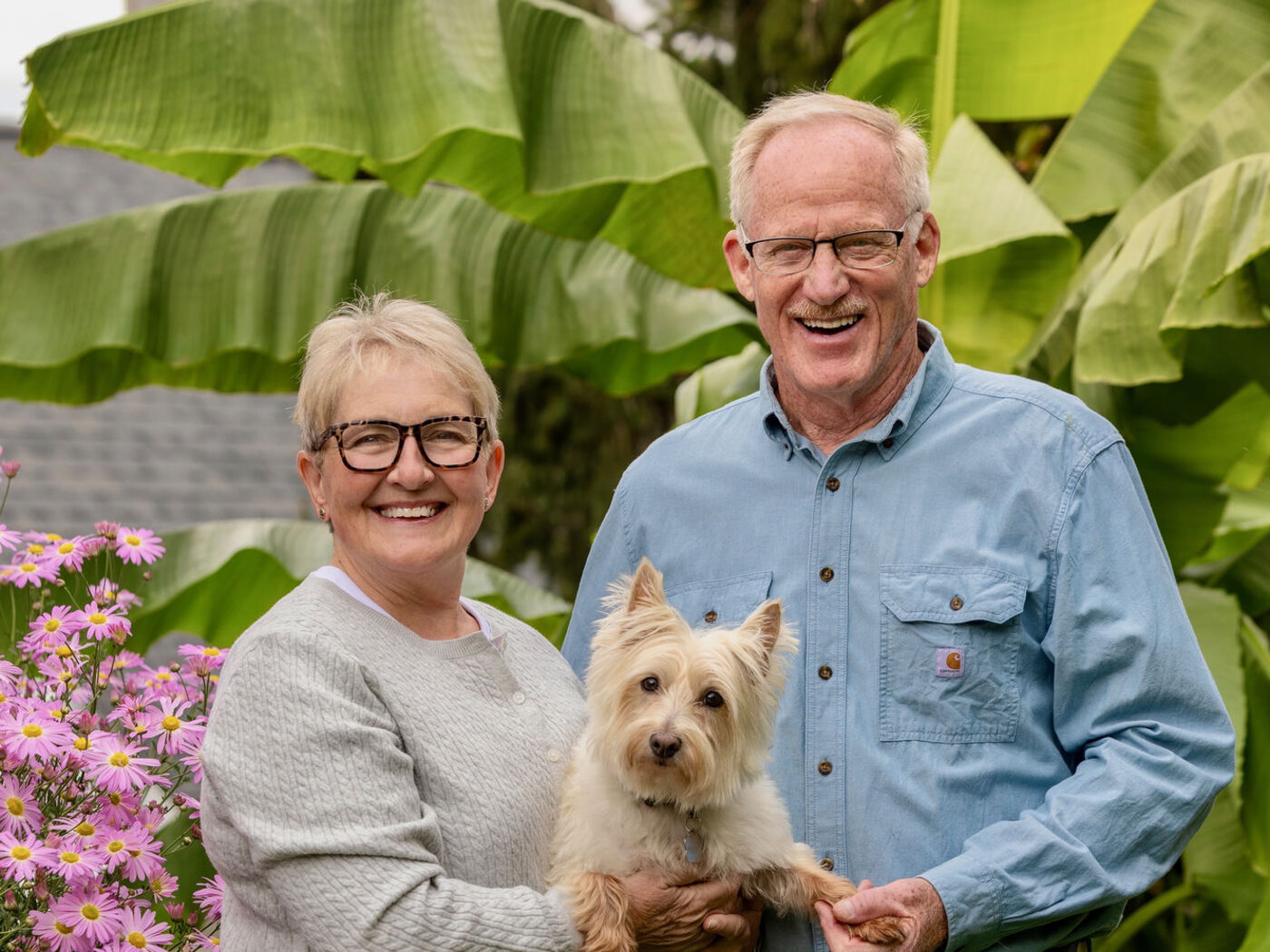Hugh and his wife with their dog